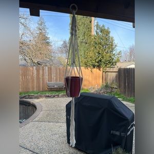 Macrame flowerpot hanger.